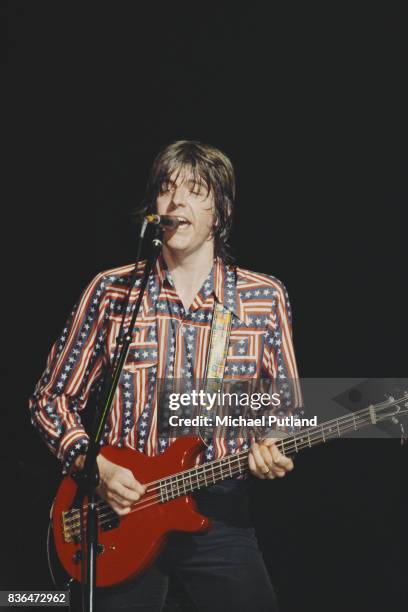 English singer-songwriter and musician Nick Lowe performs on stage with Rockpile, New York, August 1979.