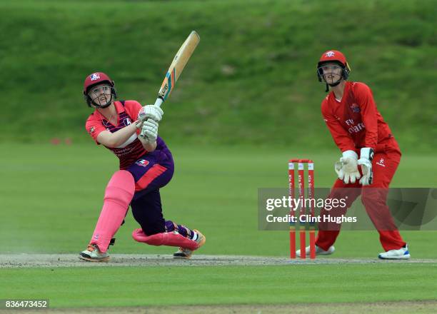 Sarah Glenn of Loughborough Lightning bats whilst Sarah Taylor of Lancashire Thunder looks on during the Kia Super League match between Lancashire...