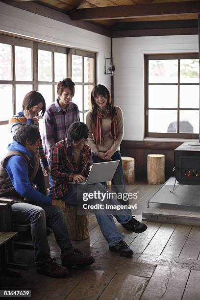 young people having fun with laptop - woman smiling facing down stock pictures, royalty-free photos & images