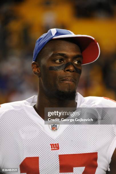 Wide receiver Plaxico Burress of the New York Giants looks on from the field after a game against the Pittsburgh Steelers at Heinz Field on October...