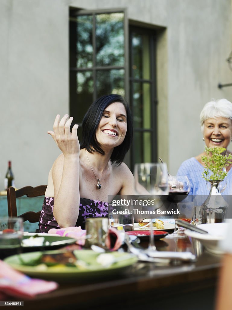 Multigenerational family at outdoor dining table