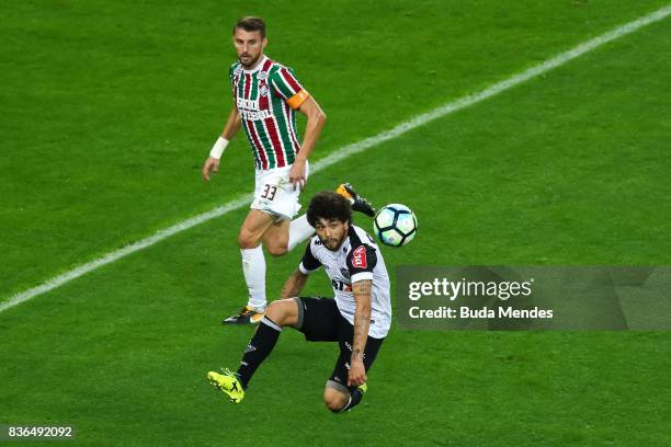 Henrique of Fluminense struggles for the ball with Luan of Atletico MG during a match between Fluminense and Atletico MG part of Brasileirao Series A...