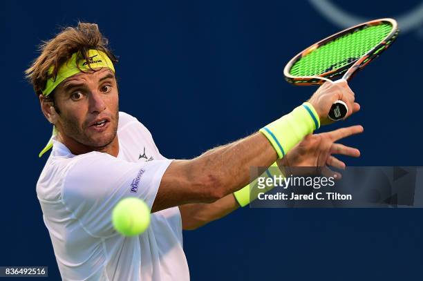 Malek Jaziri of Tunisia returns a shot from Taylor Fritz during the third day of the Winston-Salem Open at Wake Forest University on August 21, 2017...