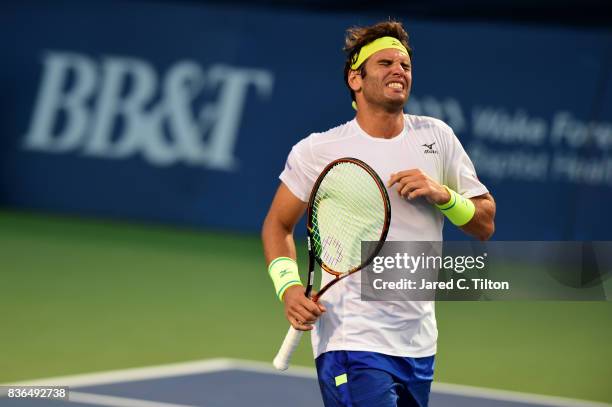 Malek Jaziri of Tunisia reacts after a point against Taylor Fritz during the third day of the Winston-Salem Open at Wake Forest University on August...