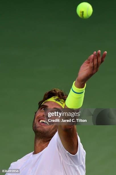 Malek Jaziri of Tunisia serves to Taylor Fritz during the third day of the Winston-Salem Open at Wake Forest University on August 21, 2017 in Winston...