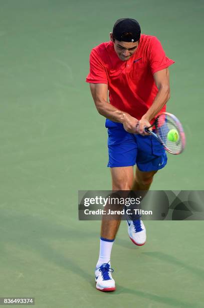 Taylor Fritz returns a shot from Malek Jaziri of Tunisia during the third day of the Winston-Salem Open at Wake Forest University on August 21, 2017...
