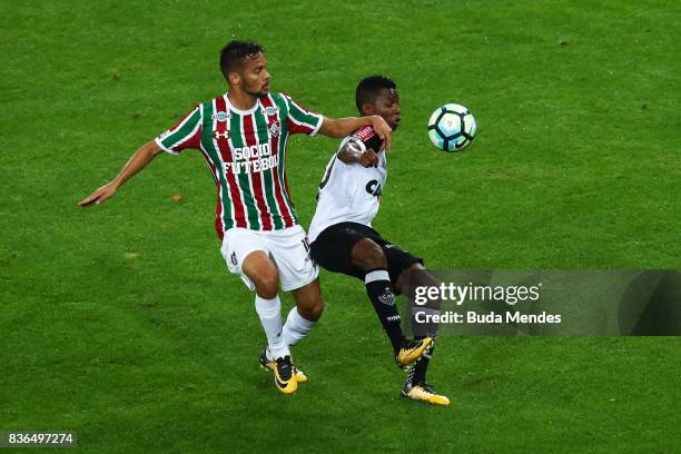 Gustavo Scarpa of Fluminense struggles for the ball with Cazares of Atletico MG during a match between Fluminense and Atletico MG part of Brasileirao...