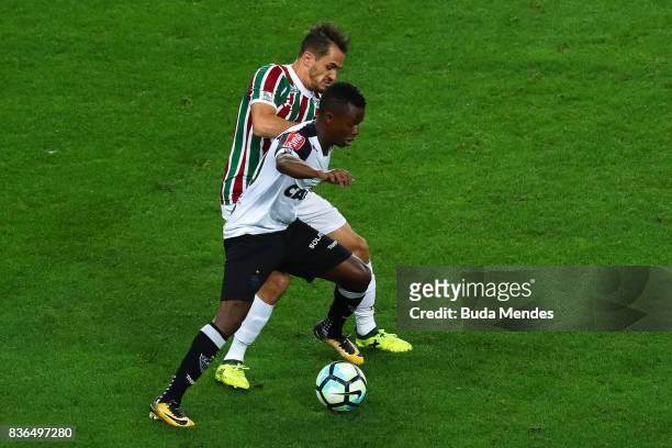 Lucas of Fluminense struggles for the ball with Cazares of Atletico MG during a match between Fluminense and Atletico MG part of Brasileirao Series A...