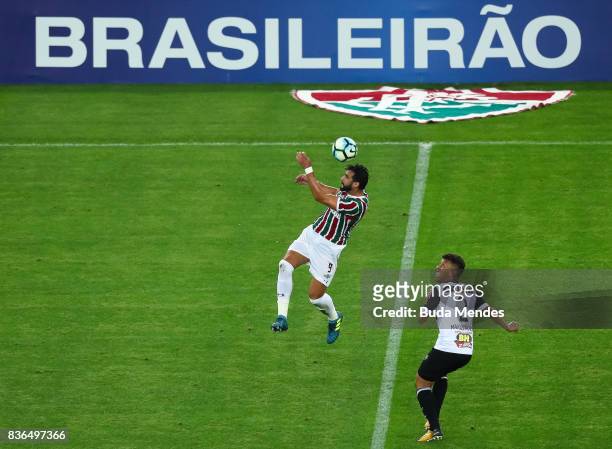 Henrique Dourado of Fluminense struggles for the ball with Marcos Rocha of Atletico MG during a match between Fluminense and Atletico MG part of...