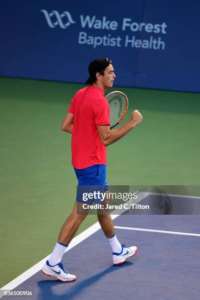 Taylor Fritz reacats after a point against Malek Jaziri of Tunisia during the third day of the Winston-Salem Open at Wake Forest University on August...