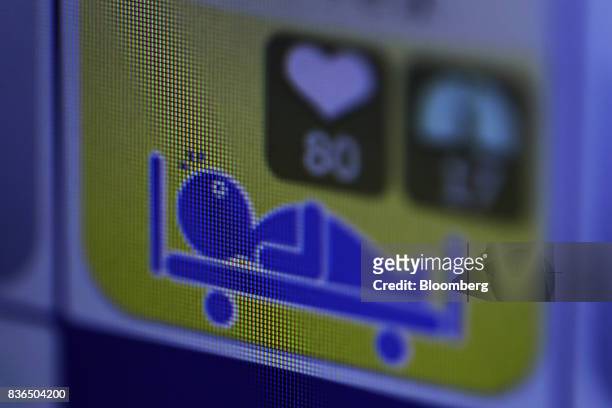 Resident's sleeping condition is displayed on the "EGAO link" system on an Apple Inc. IPhone in an arranged photograph at the As Partners Co.'s...