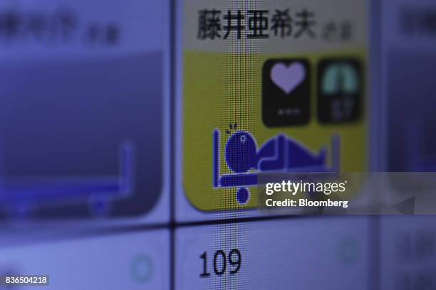 Resident's sleeping condition is displayed on the "EGAO link" system on an Apple Inc. IPhone in an arranged photograph at the As Partners Co.'s...