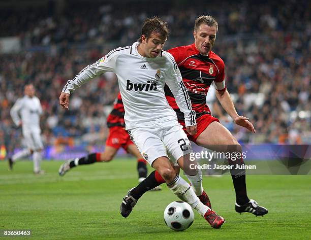 Rafael van der Vaart of Real Madrid duels for the ball with Inaki Berruet of Real Union during the round of 16, second leg Copa del Rey match between...