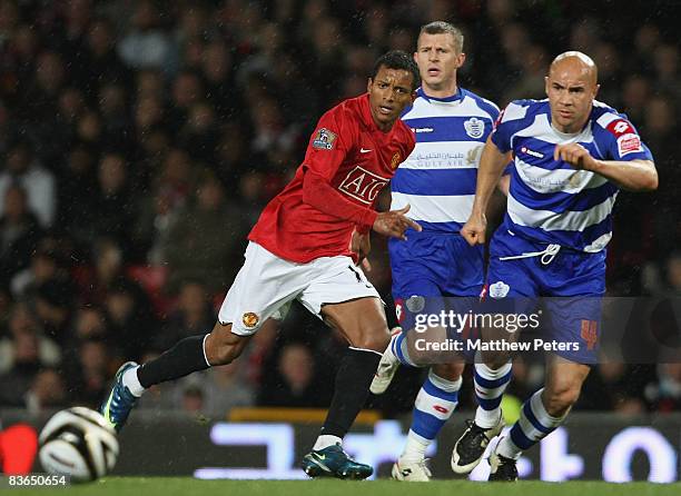 Nani of Manchester United clashes with Gavin Mahon of Queens Park Ramgers during the Carling Cup Fourth Round match between Manchester United and...