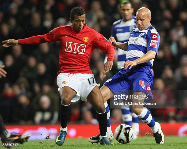 Nani of Manchester United clashes with Gavin Mahon of Queens Park Rangers during the Carling Cup Fourth Round match between Manchester United and...