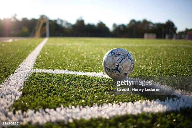 soccer ball at corner marker of soccer field - football field fotografías e imágenes de stock