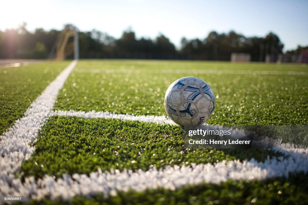 Soccer ball at corner marker of soccer field