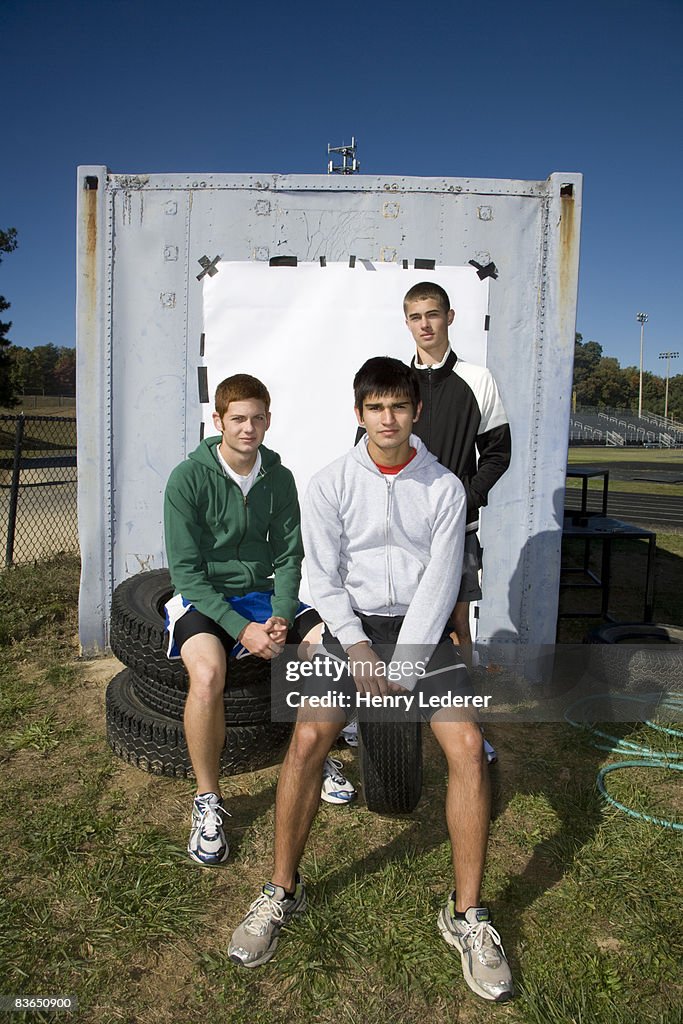 3 teenage boys in athletic wear