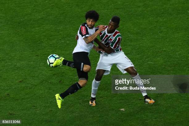 Lo Pel of Fluminense struggles for the ball with Luan of Atletico MG during a match between Fluminense and Atletico MG part of Brasileirao Series A...