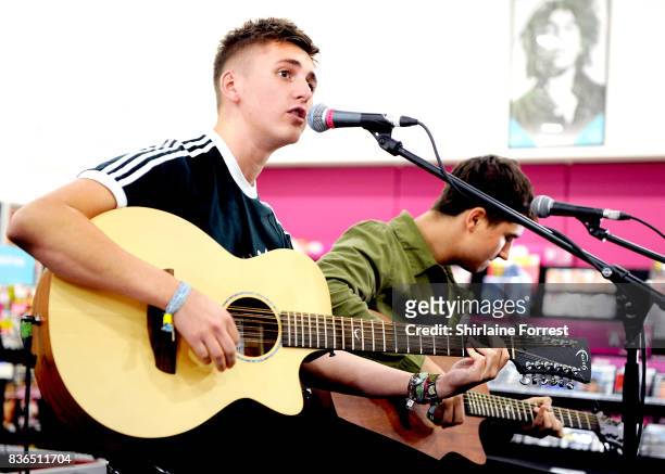 Kiaran Crook and Josh Davidson of The Sherlocks perform live and sign copies of their debut album 'Live for the Moment' during an instore session at...