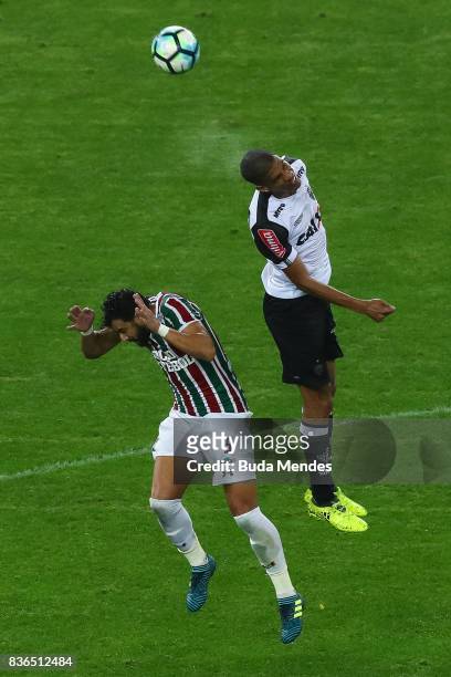 Henrique Dourado of Fluminense struggles for the ball with Leonardo Silva of Atletico MG during a match between Fluminense and Atletico MG part of...