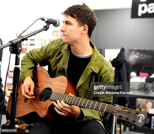 Josh Davidson of The Sherlocks performs live and signs copies of their debut album 'Live for the Moment' during an instore session at HMV Manchester...