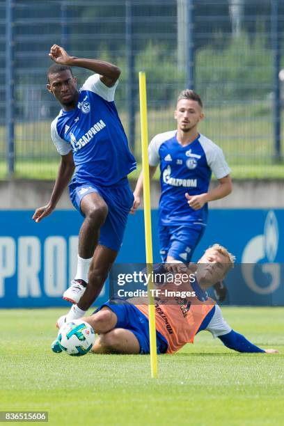 Haji Wright of Schalke and Johannes Geis of Schalke battle for the ball during a training session at the FC Schalke 04 Training center on July 5,...