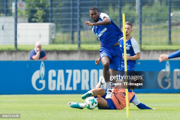 Haji Wright of Schalke and Johannes Geis of Schalke battle for the ball during a training session at the FC Schalke 04 Training center on July 5,...