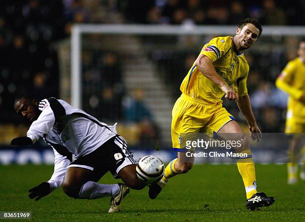 Nathan Ellington of Derby County is challenged by Frazer Richardson of Leeds United duing the Carling Cup Fourth Round match between Derby County and...