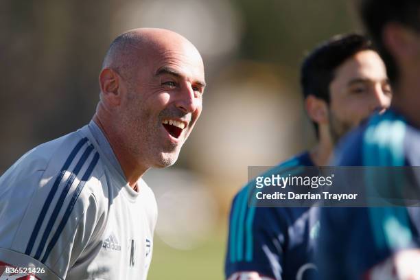 Coach of the Melbourne Victory Kevin Muscat has a laugh during a Melbourne Victory training session at AAMI Park on August 22, 2017 in Melbourne,...