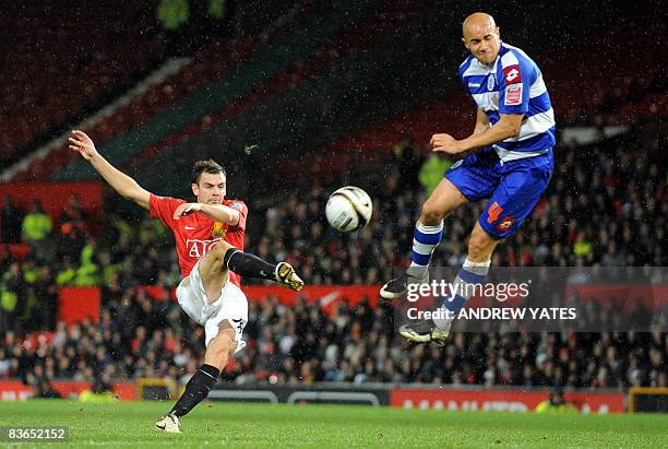 Manchester United's Irish midfielder Darron Gibson shoots past Queens Park Rangers midfielder Gavin Mahon during their Carling cup fourth round...