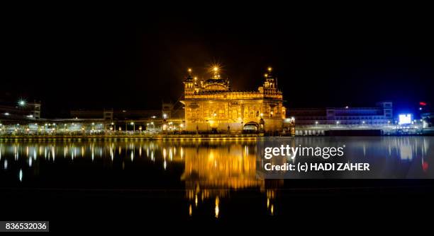 golden temple at night | amritsar | punjab | india - amritsar stock pictures, royalty-free photos & images