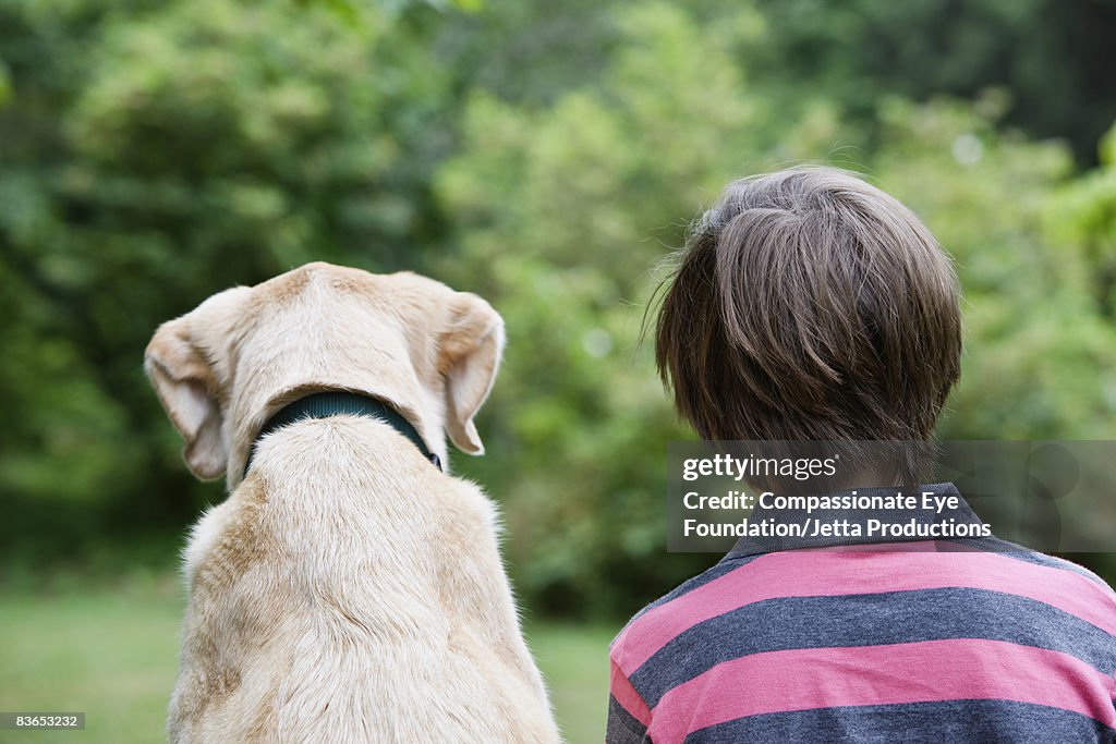 Back of boy and his dog's head