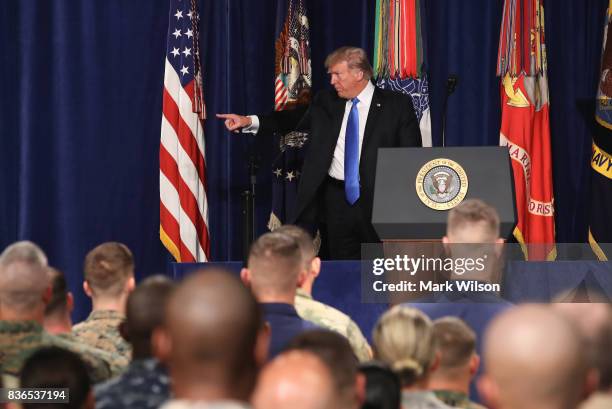 President Donald Trump acknowledges members of the military before delivering remarks on Americas involvement in Afghanistan at the Fort Myer...