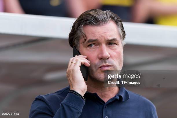 Manager Michael Zorc of Dortmund on the mobile during the preseason friendly match between Rot-Weiss Essen and Borussia Dortmund at Stadion Essen on...