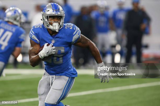 Detroit Lions running back Dwayne Washington carries the ball during a preseason game between the New York Jets and the Detroit Lions on August 19,...