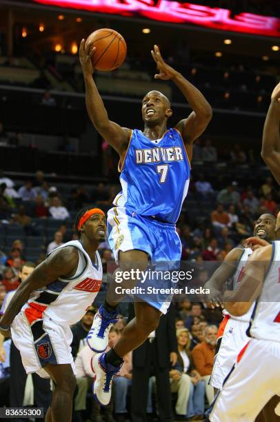 Chauncey Billups of the Denver Nuggets drives to the basket against the Charlotte Bobcats during their game at Time Warner Cable Arena on November...