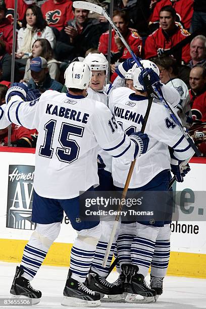 Tomas Kaberle and teammates of the Toronto Maple Leafs celebrate a goal against the Calgary Flames on November 11, 2008 at Pengrowth Saddledome in...