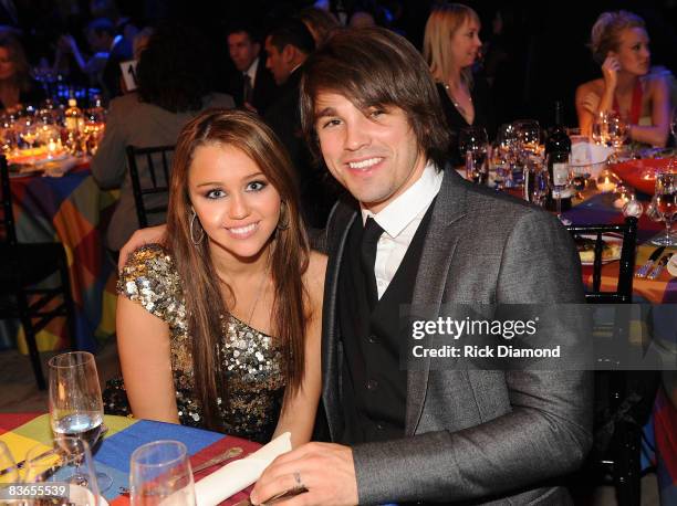 Miley Cyrus and Justin Gaston attends the 56th Annual BMI Country Awards at The BMI Building on November 11, 2008 in Nashville, Tennessee.