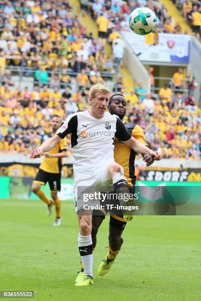 Philipp Klingmann of SV Sandhausen and Erich Berko of Dresden battle for the ball during the Second Bundesliga match between Dynamo Dresden and SV...