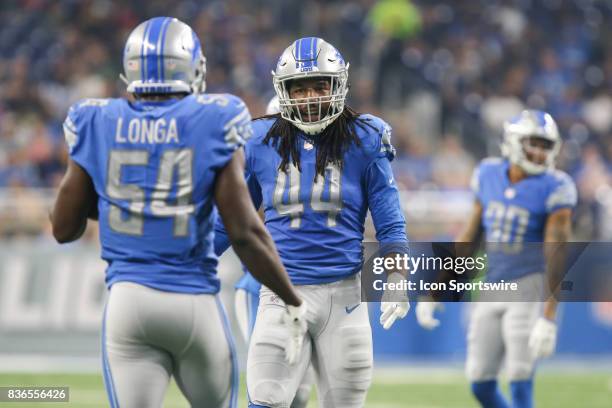 Detroit Lions linebacker Jalen Reeves-Maybin talks with Detroit Lions linebacker Steve Longa during a preseason game between the New York Jets and...