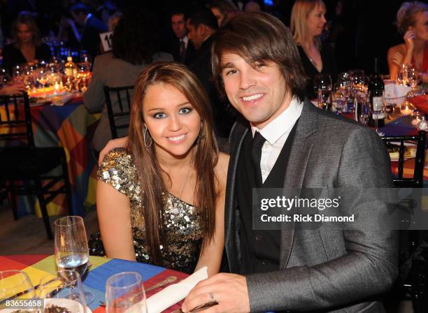 Miley Cyrus and Justin Gaston attends the 56th Annual BMI Country Awards at The BMI Building on November 11, 2008 in Nashville, Tennessee.