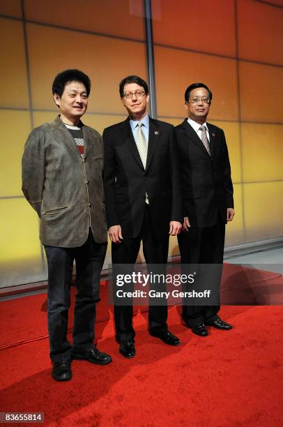 Director Xue Weijun, producer Li Zhi-Xiang and president of Nederlander Worldwide Robert Nederlander Jr. Pose for pictures during a press preview of...