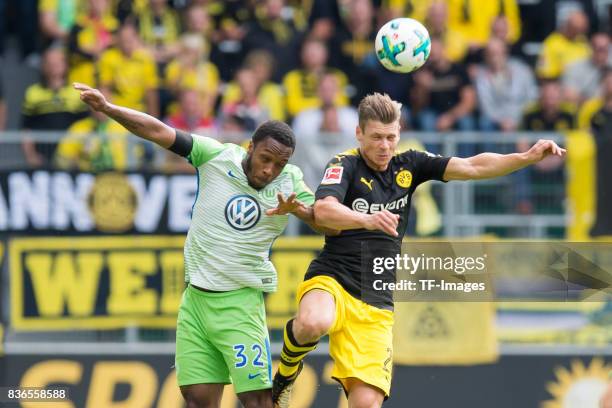 Kaylen Hinds of Wolfsburg and Lukasz Piszczek of Dortmund battle for the ball during to the Bundesliga match between VfL Wolfsburg and Borussia...