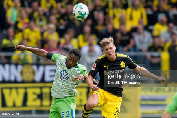 Kaylen Hinds of Wolfsburg and Lukasz Piszczek of Dortmund battle for the ball during to the Bundesliga match between VfL Wolfsburg and Borussia...