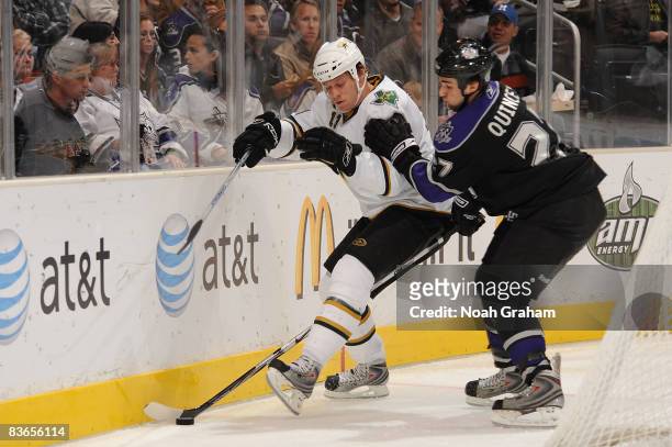 Krys Barch of the Dallas Stars battles alongside the boards with Kyle Quincey of the Los Angeles Kings during the game on November 11, 2008 at...