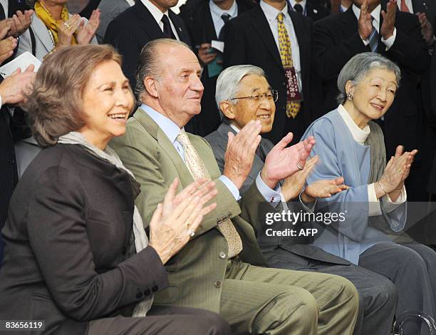 Spanish Queen Sofia King Juan Carlos , Japan's Emperor Akihito and Empress Michiko clap while watching a performance of robot suit HAL which can lift...