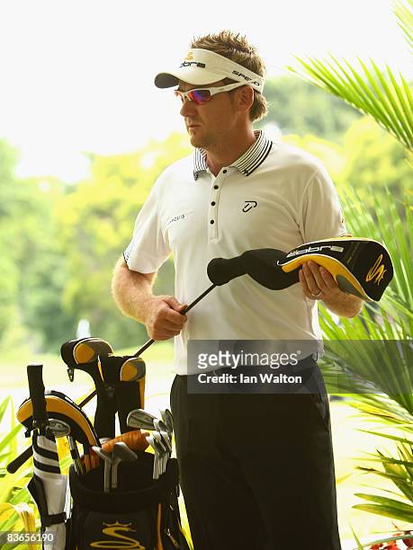 Ian Poulter of England removes the cover from his new driver during the Peo-Am of the Barclays Singapore Open at Sentosa Golf Club on November 12,...