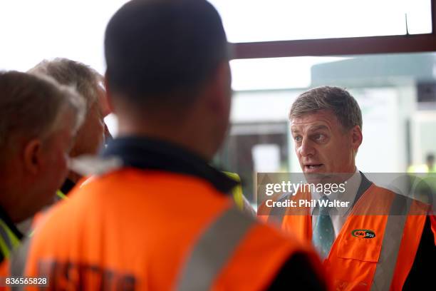 New Zealand Prime Minister Bill English speaks to produce packers at the Balle Brothers fresh produce plant in Pukekohe on August 22, 2017 in...