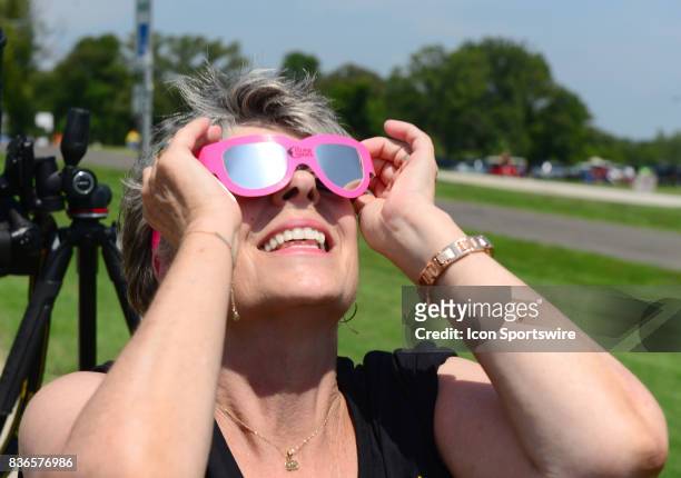 Spectator watches the progress of the eclipse during a total eclipse of the sun on August 21 as viewed from the Cohen Recreation Center in Chester,...
